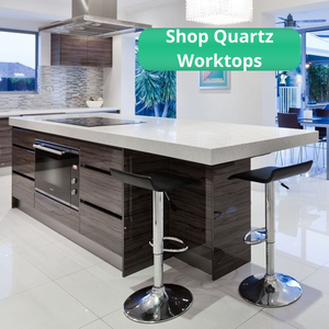 Kitchen island with brown gloss units and thick white sparkle quartz kitchen worktop. White tiled floor and black & chrome breakfast bar stools.